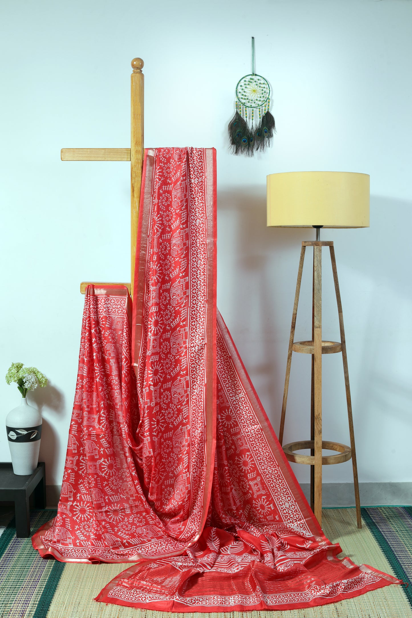 Silk blend - orangish body with warli inspired prints in offwhite with a zari