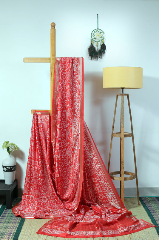 Silk blend - orangish  body with warli inspired prints in offwhite with a zari