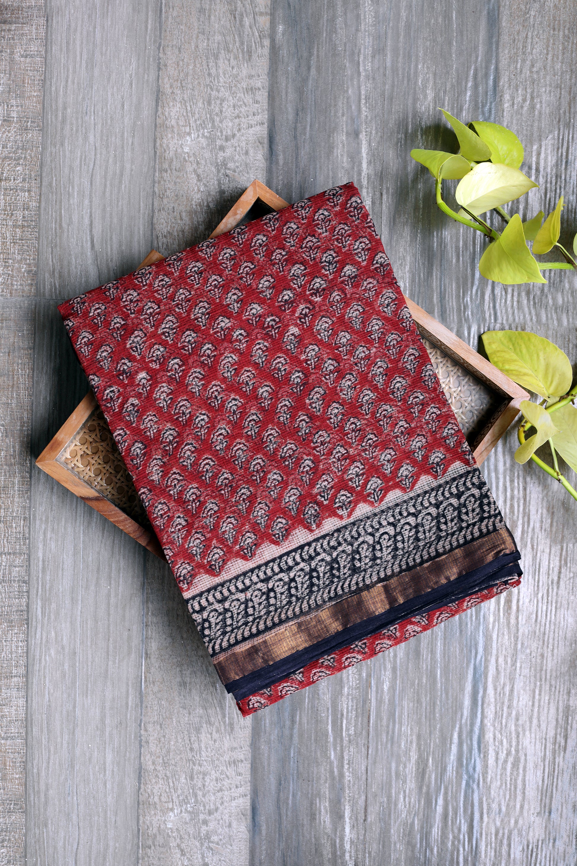 Bagru printed brick red  saree with  black prints with black border and zari