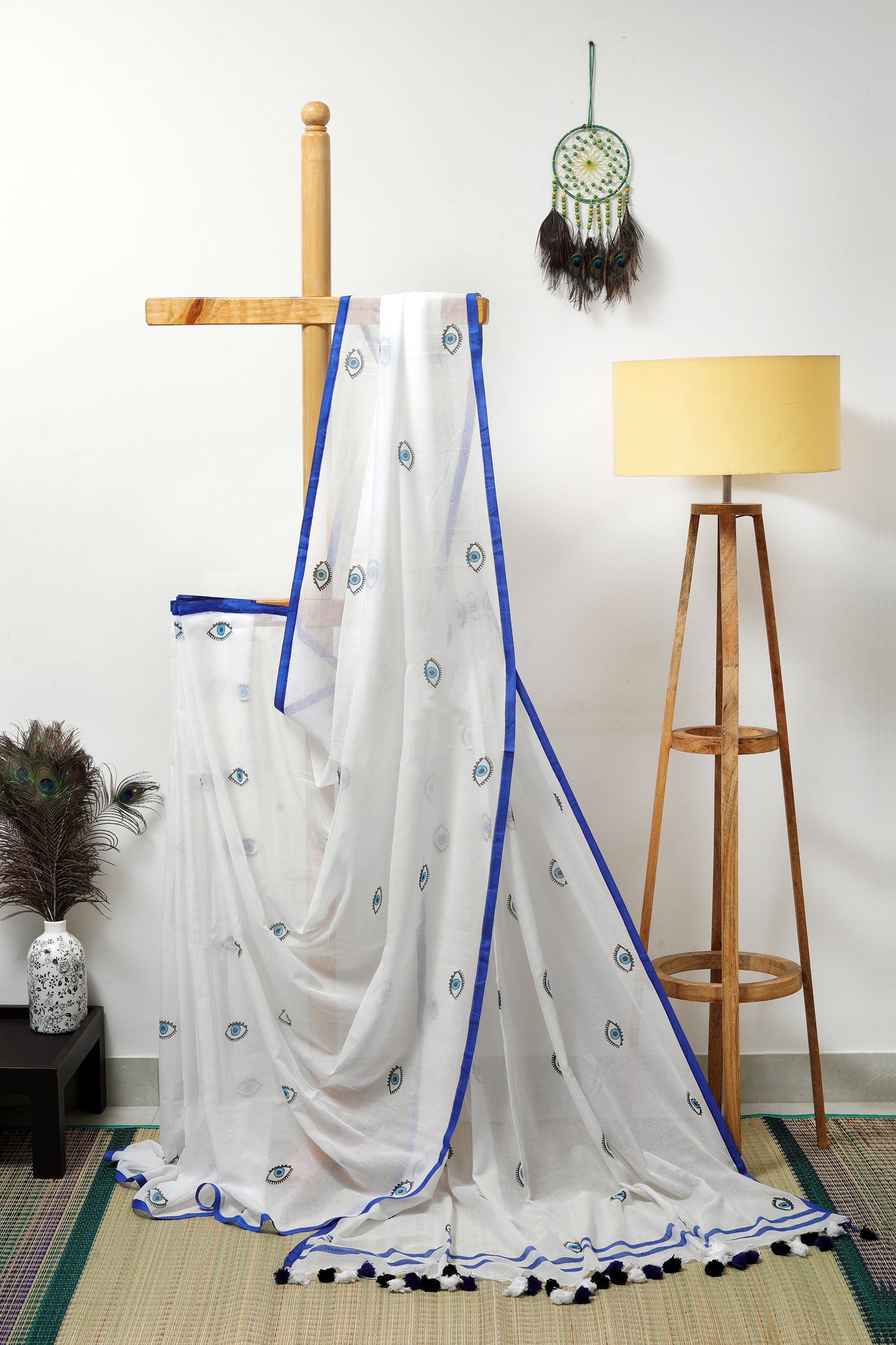Mul Cotton - milky white with quirky evil eye prints