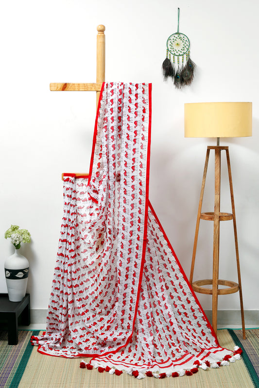 this feather-light milky white mul cotton and skin-loving, &nbsp;saree with quirky camel prints in red blends storytelling with style