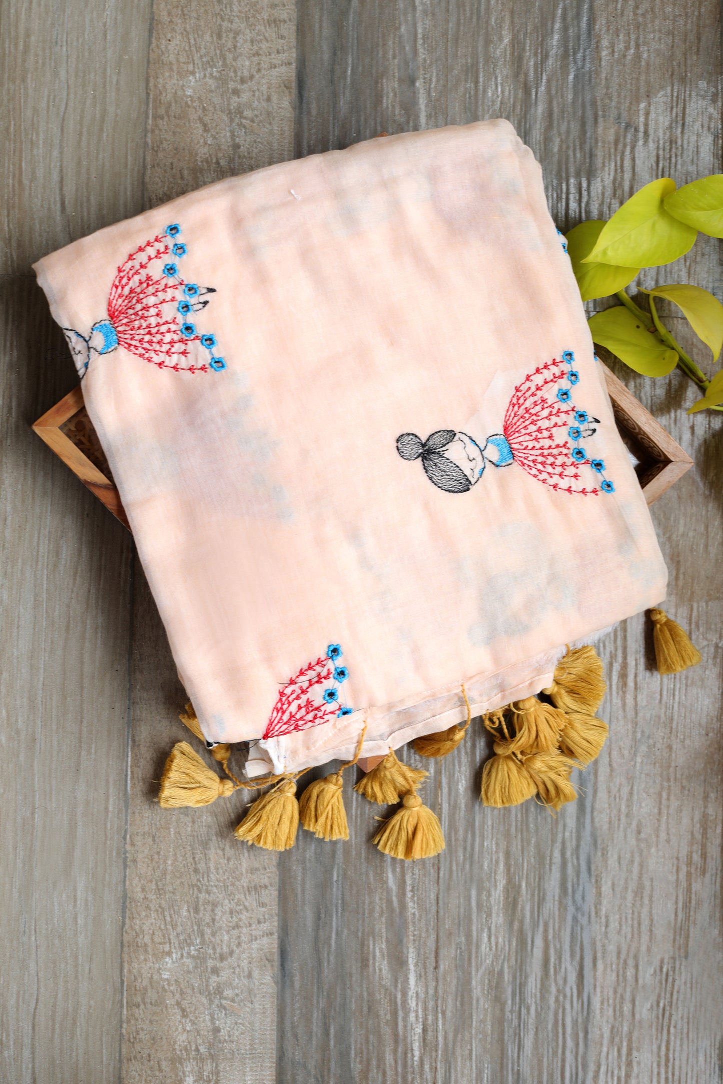 Mul cotton  - light peach saree with doll embroidery and mustard tassels