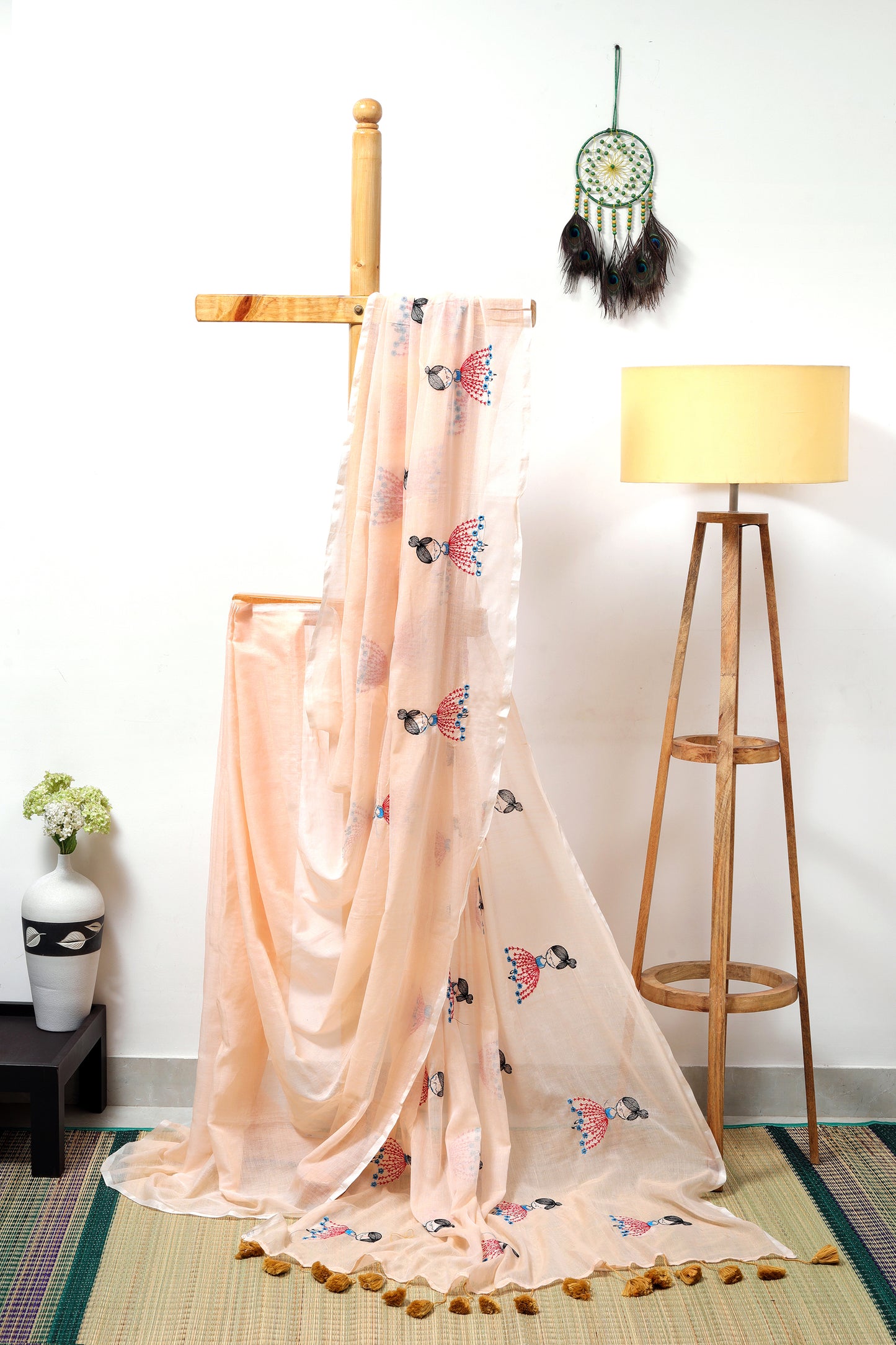 Mul cotton  - light peach saree with doll embroidery and mustard tassels