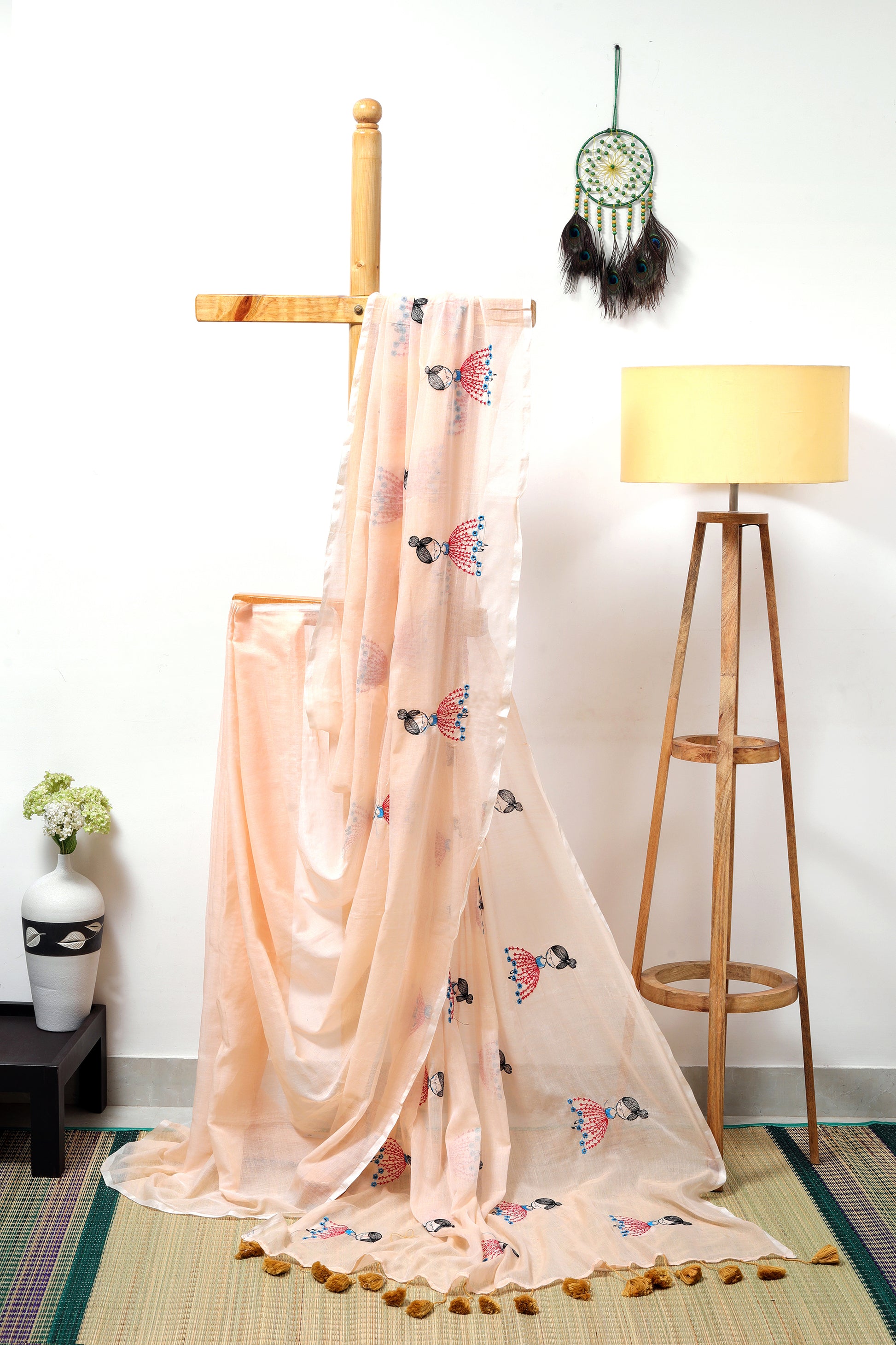 Mul cotton  - light peach saree with doll embroidery and mustard tassels