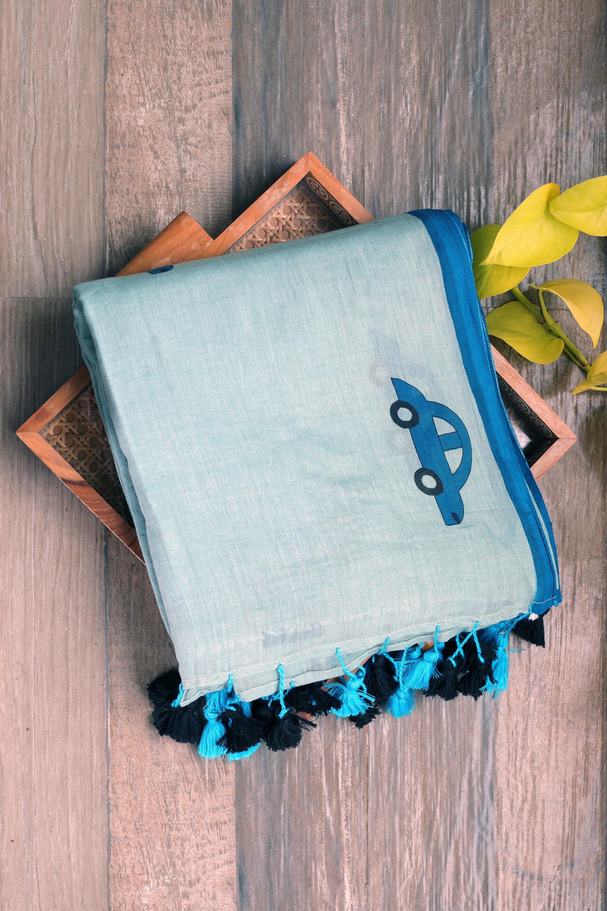 Mul cotton - pastel blue with dark blue car and scooter prints with multicolored  tassels