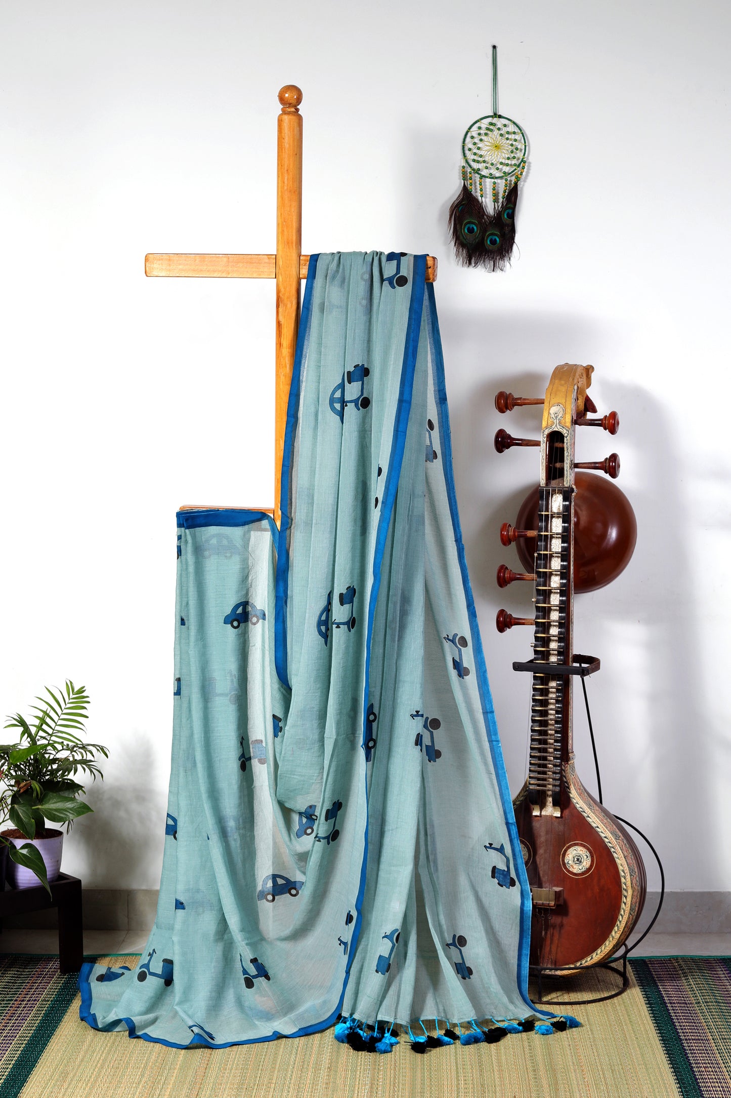 Mul cotton - pastel blue with dark blue car and scooter prints with multicolored  tassels