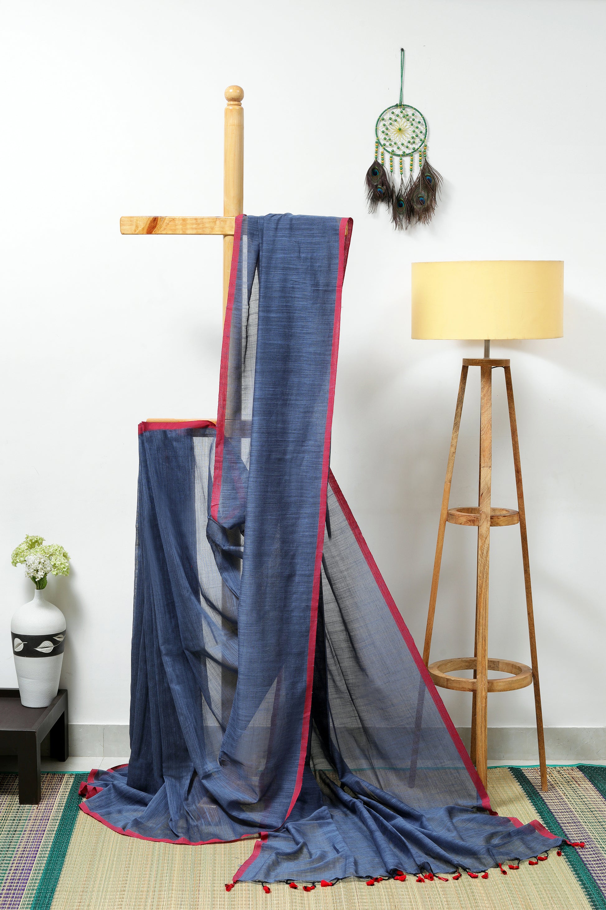 Soft cotton - grey   with a reddish border and red tassels